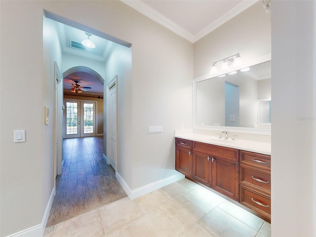 bathroom featuring vanity, tile patterned flooring, crown molding, and french doors