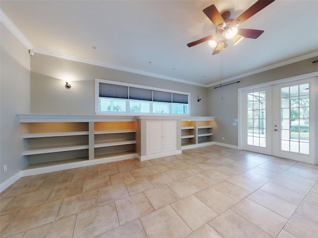 unfurnished living room with built in shelves, light tile patterned flooring, french doors, crown molding, and ceiling fan