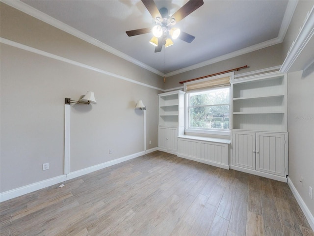 spare room with crown molding, ceiling fan, and light hardwood / wood-style floors