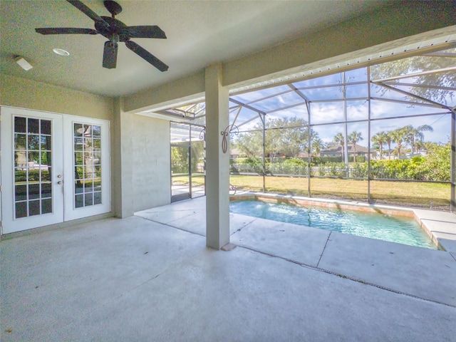 view of pool featuring french doors, glass enclosure, and a patio area