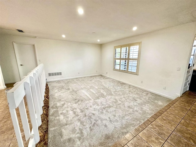 empty room featuring carpet floors