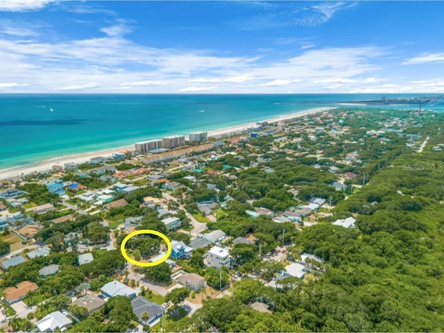 birds eye view of property featuring a view of the beach and a water view