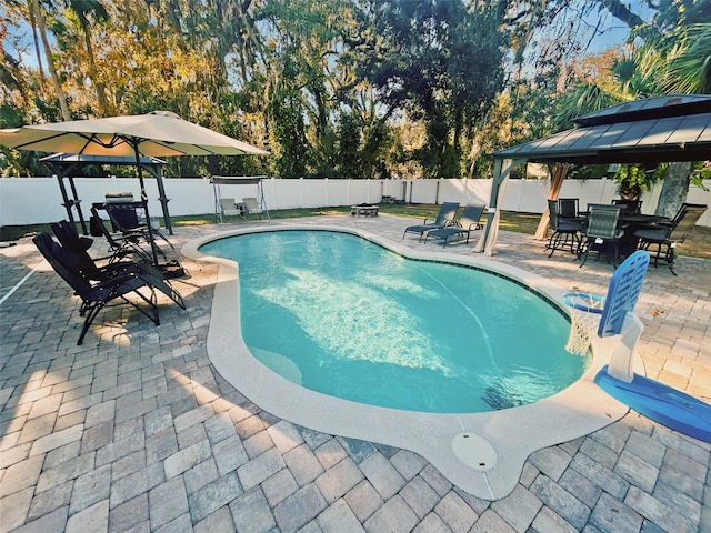 view of pool featuring a gazebo and a patio