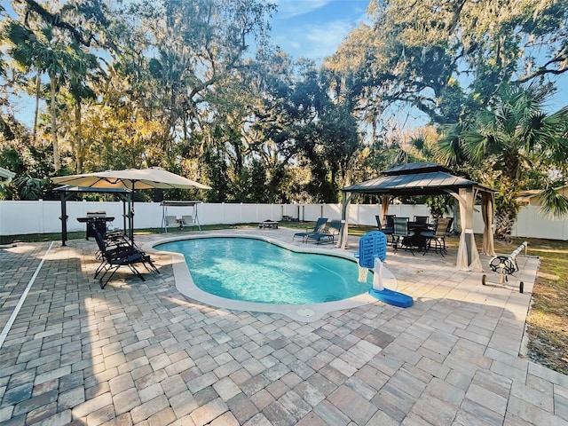 view of swimming pool featuring a gazebo and a patio