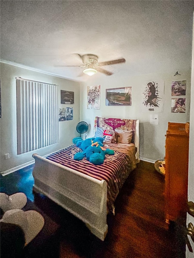 bedroom featuring a textured ceiling and ceiling fan