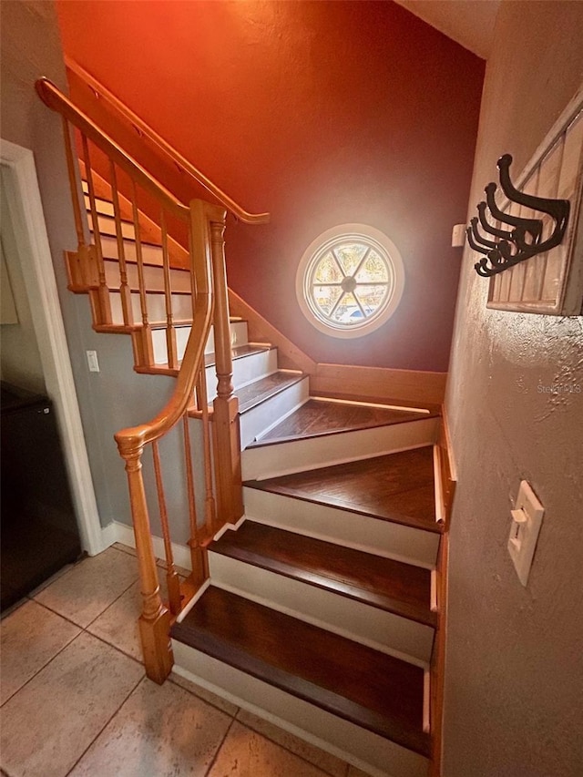 staircase with tile patterned flooring