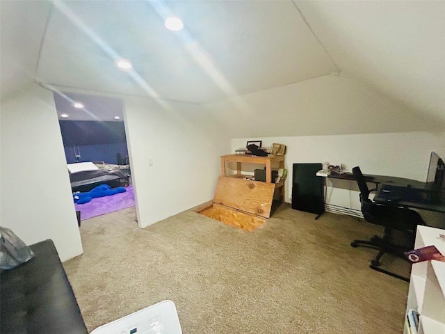 office area featuring lofted ceiling and carpet flooring