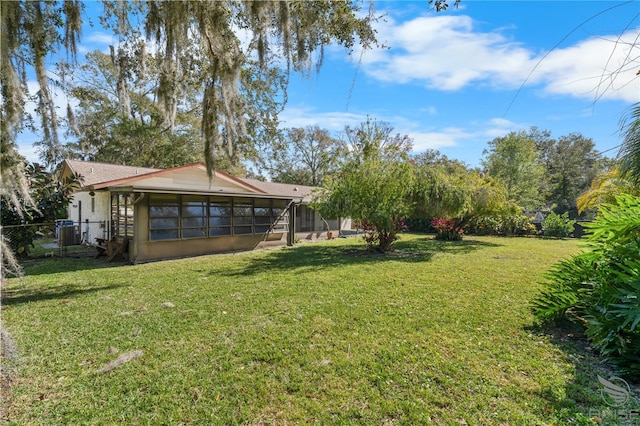 view of yard featuring a sunroom