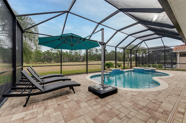 view of pool with glass enclosure, an in ground hot tub, and a patio