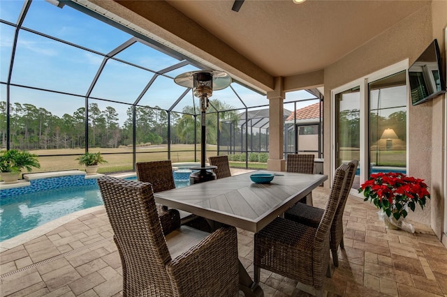 view of patio / terrace featuring glass enclosure