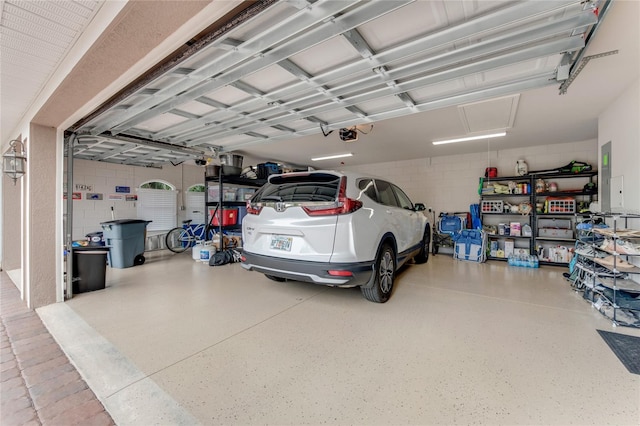 garage featuring a garage door opener