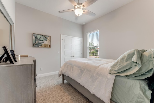 bedroom featuring light colored carpet and ceiling fan