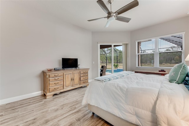 bedroom featuring light wood-type flooring, ceiling fan, and access to outside