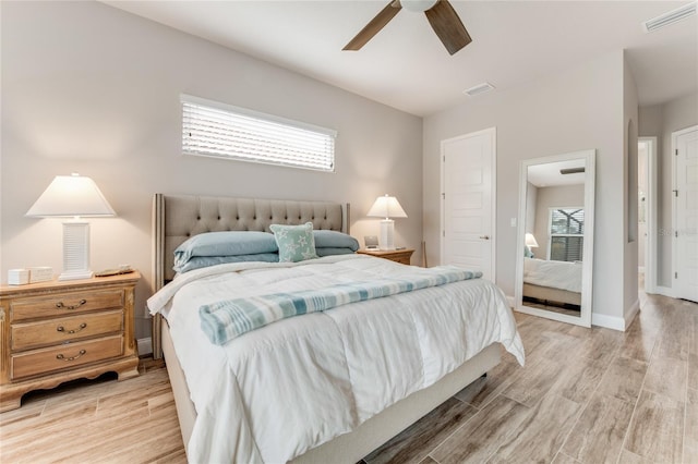 bedroom with ceiling fan and light hardwood / wood-style floors