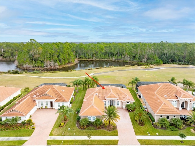 birds eye view of property with a water view