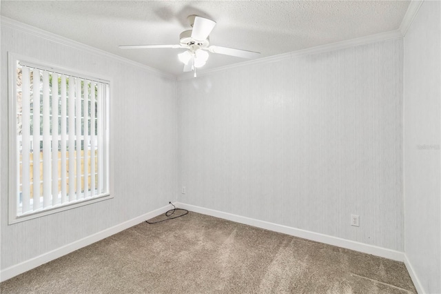 carpeted empty room with ceiling fan, crown molding, plenty of natural light, and a textured ceiling