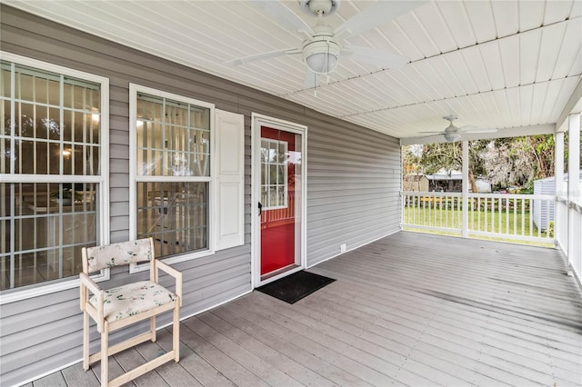 wooden deck featuring a ceiling fan