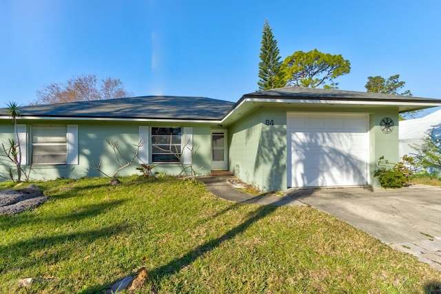 ranch-style home with a garage and a front lawn