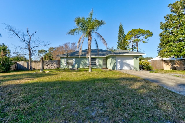 ranch-style house with a garage and a front yard