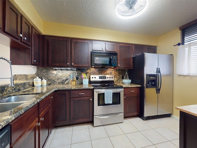 kitchen featuring sink, tasteful backsplash, light tile patterned floors, stone counters, and stainless steel appliances