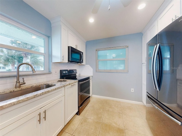 kitchen with double oven range, backsplash, fridge, and white cabinets