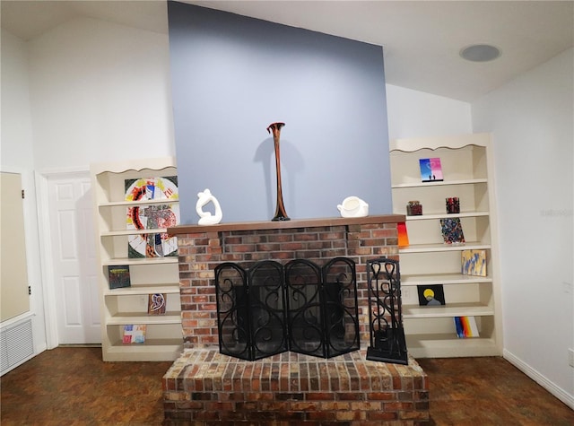 interior details with a brick fireplace