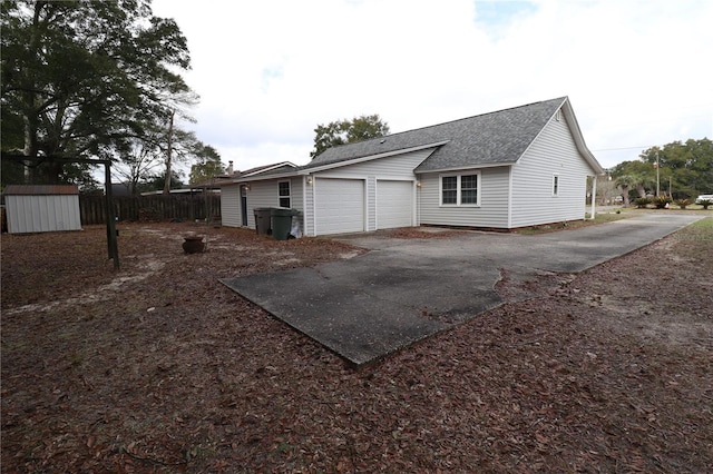 back of house featuring a garage