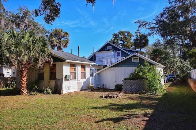 exterior space with cooling unit and a front lawn