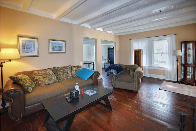 living room featuring dark wood-type flooring and beam ceiling