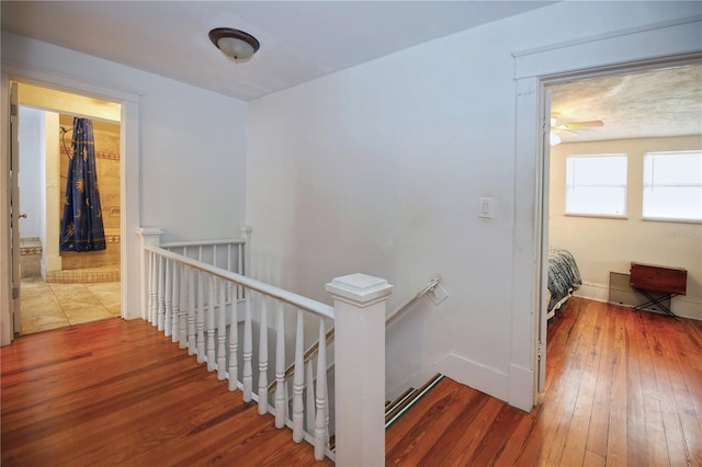 stairway with wood-type flooring