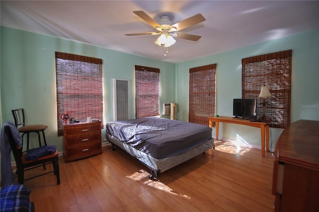 bedroom featuring ceiling fan and light wood-type flooring