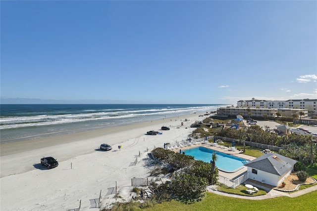 aerial view featuring a water view and a view of the beach