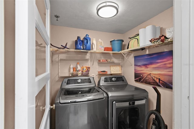 washroom featuring washer and dryer