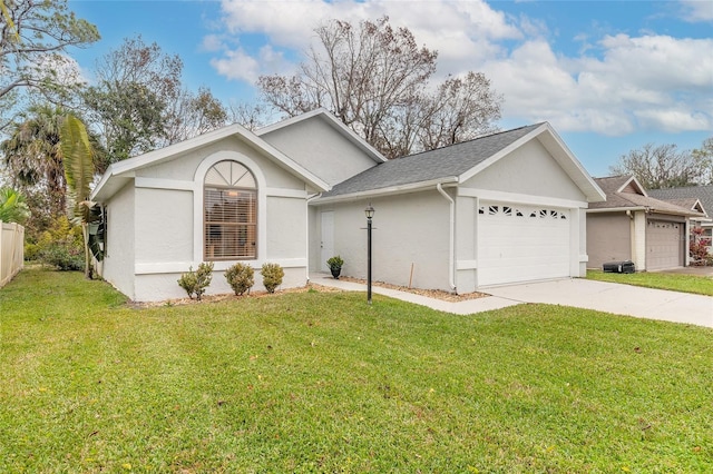 ranch-style house with a garage and a front lawn