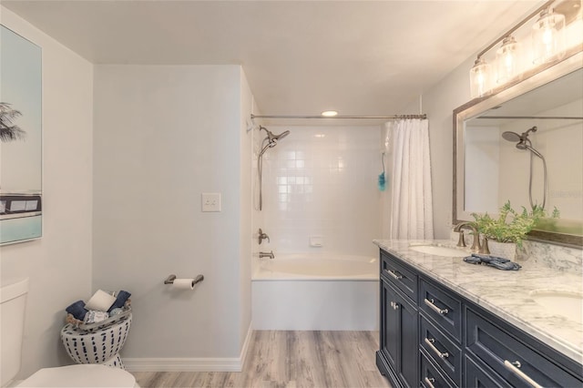 full bathroom with wood-type flooring, vanity, shower / bath combination with curtain, and toilet