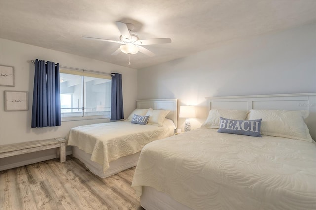 bedroom with hardwood / wood-style floors and ceiling fan