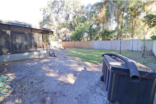 view of yard featuring a sunroom