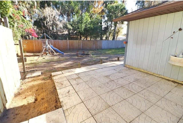 view of patio featuring a playground