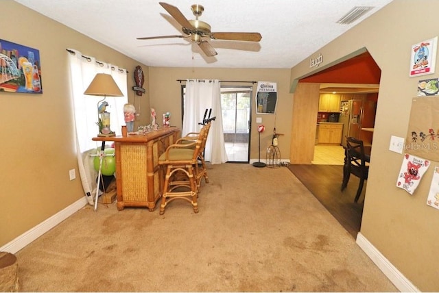 office space with carpet flooring and ceiling fan