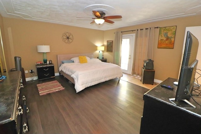 bedroom with hardwood / wood-style floors and ceiling fan