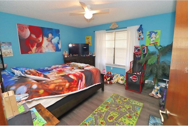 bedroom featuring ceiling fan and hardwood / wood-style floors