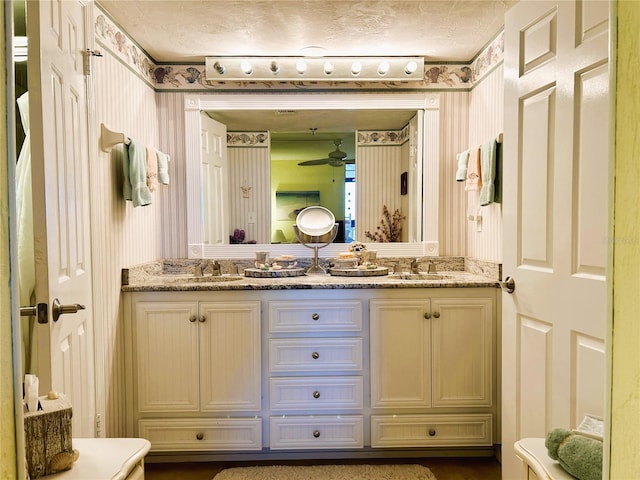 bathroom featuring vanity and a textured ceiling