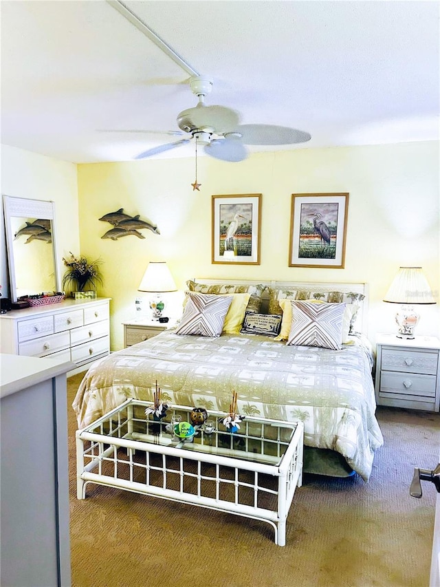 bedroom featuring ceiling fan and carpet floors