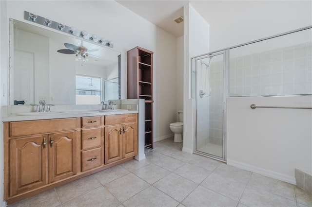 bathroom with double vanity, a stall shower, and a sink