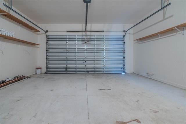 garage featuring concrete block wall