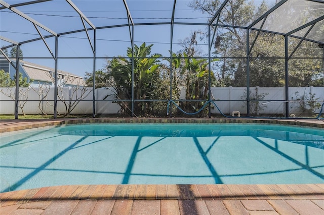 view of pool featuring a lanai, a fenced backyard, and a fenced in pool