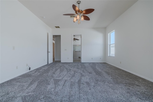 unfurnished bedroom with ceiling fan, visible vents, baseboards, a spacious closet, and carpet