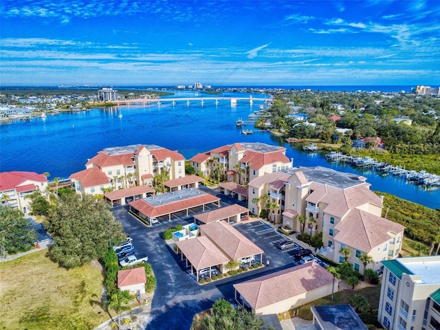 birds eye view of property with a water view