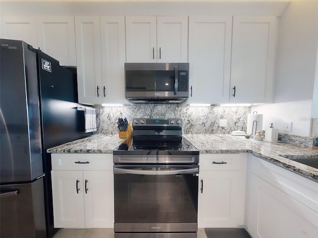 kitchen with white cabinetry and stainless steel appliances