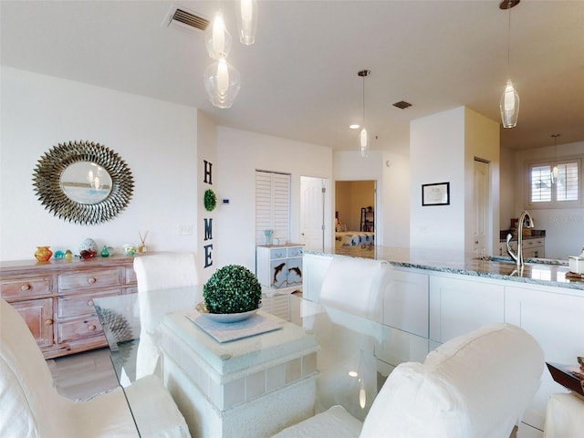 dining space featuring sink